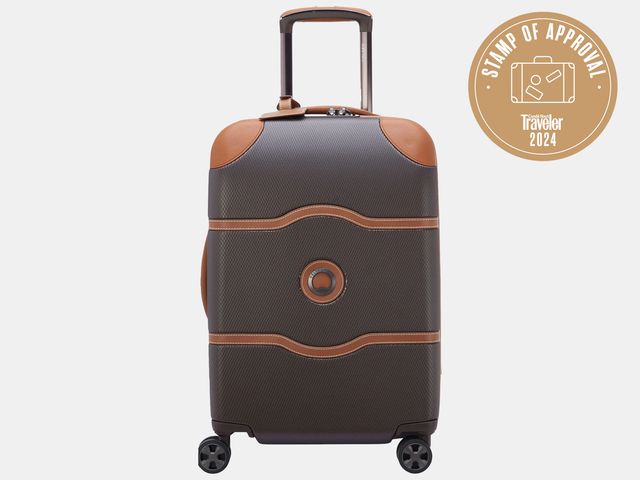 Image may contain Baggage Suitcase Device Grass Lawn Lawn Mower Plant and Tool